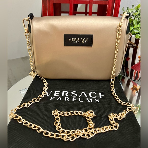 Versace Handbags - NEW! Versace gold crossbody parfums cosmetic bag w/dust bag and crossbody chain!